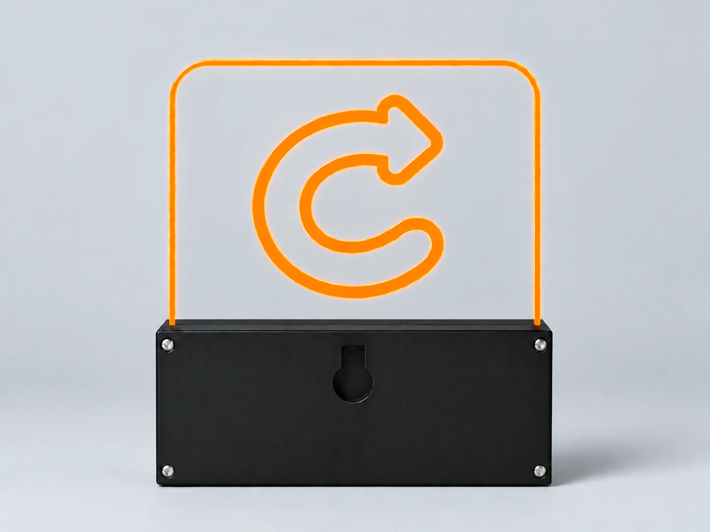 The back of the Constian sign glowing orange, with its wall-mount keyhole